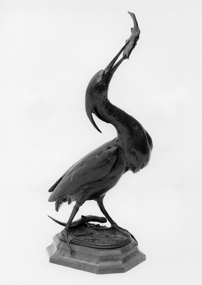 Statue of a heron eating a fish
